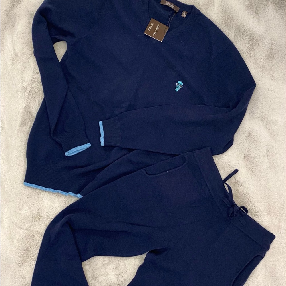 Man and women cashmere sweaters and pants/ joggers.